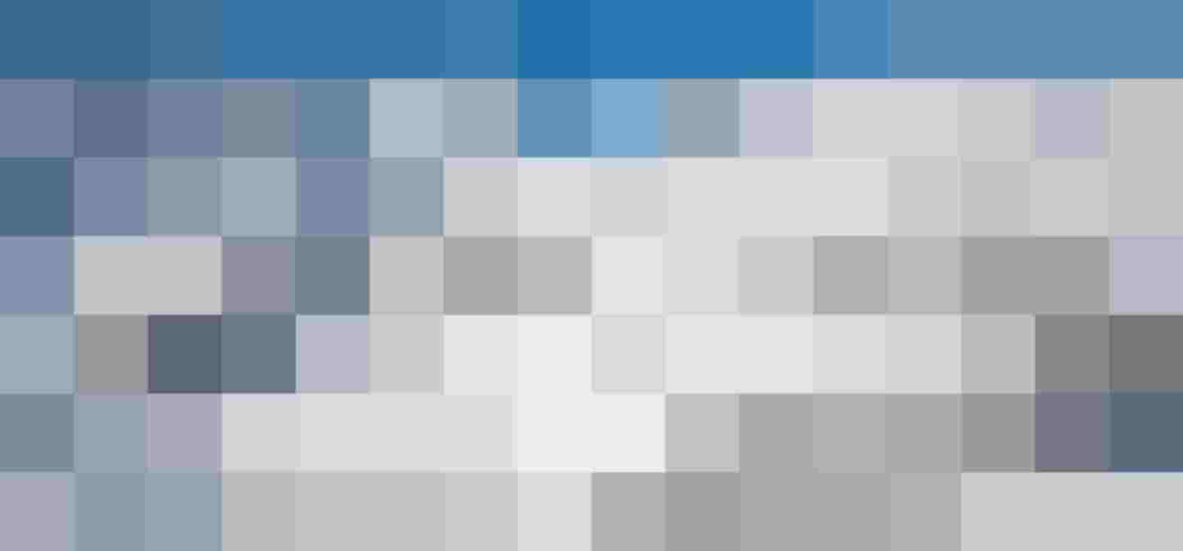 Snow-covered Mountains and Ski Resort Surrounded by Brilliant Blue Sky in the Alps.